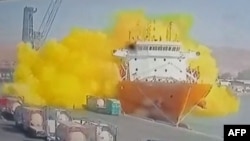 This image grab taken from a CCTV footage broadcasted by Jordan's Al-Mamlaka TV on June 27, 2022 shows the moment of a toxic gas explosion on the Hong Kong-flagged vessel 'Forest 6' in Jordan's Aqaba port. (AFP photo /Al Mamlaka TV) 