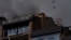 Birds fly over a residential building following explosions in Kyiv, Ukraine, June 26, 2022. 