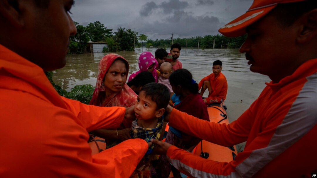 National Disaster Response Force (NDRF) personnel rescue flood-affected villagers in Korora village, west of Gauhati, India, June 17, 2022. 