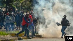 Demonstrators clash with riot police in the El Arbolito park area in Quito, June 22, 2022, on the 10th consecutive day of Indigenous-led protests against the Ecuadorean government.