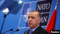 FILE - Turkish President Recep Tayyip Erdogan speaks during a news conference following a NATO summit, in Brussels, Belgium, 3.24.2022