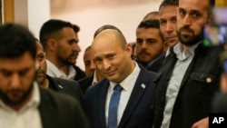 Israeli Prime Minister Naftali Bennett arrives to deliver a statement at the Knesset, Israel's parliament, in Jerusalem, June 29, 2022.