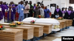 Coffins are pictured during a une 17, 2022, memorial service for victims killed during an attack by gunmen during a June 5 mass at St. Francis Catholic Church, in Owo, Ondo, Nigeria. 