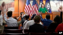 FILE - Reporters ask House Speaker Nancy Pelosi questions during her weekly press conference, May 12, 2022, in Washington.