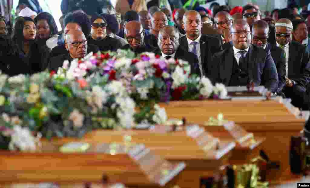 South African President Cyril Ramaphosa looks on as he joins mourners gathered in the coastal city of East London to grieve the still-mysterious deaths of 21 teenagers in a poorly ventilated local tavern, in East London, in the Eastern Cape province, South Africa.