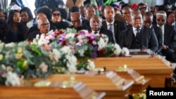 South African President Cyril Ramaphosa joins mourners gathered in the coastal city of East London to grieve the still-mysterious deaths of 21 teenagers in a tavern, in East London, in the Eastern Cape province, South Africa, July 6, 2022.