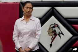 U.S. Secretary of the Interior Deb Haaland listens during ceremonies before a meeting to hear about the painful experiences of Native Americans who were sent to government-backed boarding schools designed to strip them of their cultural identities, July 9