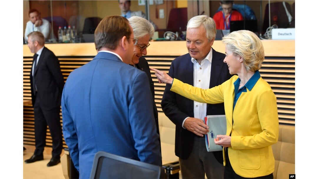 European Commission President Ursula von der Leyen, right, speaks with colleagues during a meeting of the College of Commissioners at EU headquarters in Brussels, June 17, 2022.