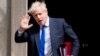 British Prime Minister Boris Johnson gestures as he leaves 10 Downing Street in London, on July 6, 2022. British media reported Thursday that Prime Minister Boris Johnson plans to resign. 