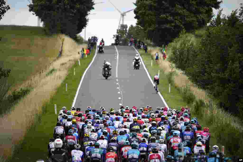 The pack rides during the sixth stage of the Tour de France cycling race over 220 kilometers (136.7 miles) with start in Binche and finish in Longwy, France.