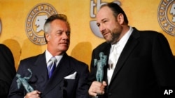 FILE - Tony Sirico, left, and James Gandolfini hold their awards for best ensemble in a drama for their work in 'The Sopranos' at the 14th Annual Screen Actors Guild Awards on Jan. 27, 2008, in Los Angeles.