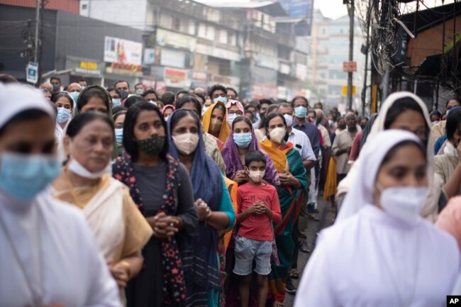 Indian Christians wearing masks as a precaution against COVID-19 gather for prayers as they observe Palm Sunday in Kochi, Kerala state, India, April 10, 2022. (AP Photo/R S Iyer, File)