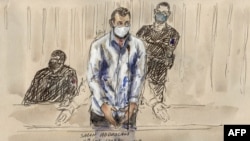 FILE - In this file photo of a court sketch made on Feb. 9, 2022, defendant Salah Abdeslam stands before Paris' special criminal court during the trial of the Nov. 2015 attacks. (Photo by Benoit Peyrucq/AFP)