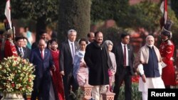 FILE - India's Prime Minister Narendra Modi (R) and Indian Vice President Venkaiah Naidu (C, in black) with other ASEAN head of states arrive to attend the "At Home" reception at the Indian presidential palace after the Republic Day parade in New Delhi, Jan. 26, 2018.