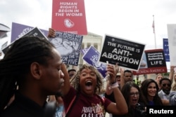 Anti-abortion demonstrators celebrate outside the U.S. Supreme Court as the court overturned the landmark Roe v Wade abortion decision in Washington, U.S., June 24, 2022. (REUTERS/Evelyn Hockstein)