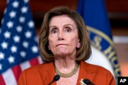 FILE - Speaker of the House Nancy Pelosi, D-Calif., reacts to the Supreme Court decision overturning Roe v. Wade, during a news conference at the Capitol in Washington, June 24, 2022.