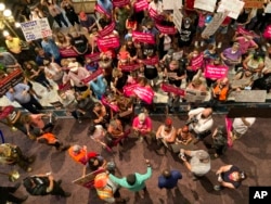 FILE - South Carolina House Rep. Gilda Cobb-Hunter, D-Orangeburg, is confronted by protesters who support more abortion restrictions as she speaks to protesters upset at the recent U.S. Supreme Court ruling removing protections for abortions, in Columbia, South Carolina, June 28, 2022.