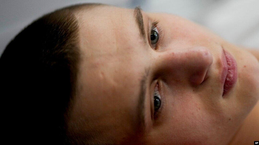 "Buffalo," the name he uses as a soldier, lies on a bed at a clinic in Kyiv, Ukraine, June 17, 2022. A series of clandestine helicopter missions to reach the Azovstal defenders in March and April are being celebrated in Ukraine as some of the most heroic feats of the four-month war.