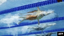 FILE - China's Zhang Ke competes in a heat for the women's 1500m freestyle event during the Budapest 2022 World Aquatics Championships at Duna Arena in Budapest on June 19, 2022