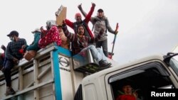 People celebrate after an agreement between Indigenous organizations and Ecuador's government was signed, in Quito, Ecuador, June 30, 2022.