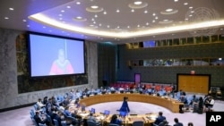 Sadya Touré, Director of Mali Musso, on screen, addresses the United Nations Security Council, June 13, 2022 at United Nations Headquarters. The U.N.'s mission in the West African nation is up for renewal this month, at a volatile time when extremist atta