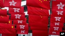 Chinese and Hong Kong flags are hanged to celebrate the 25th anniversary of Hong Kong handover to China, in Hong Kong, June 17,2022.