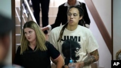 WNBA star and two-time Olympic gold medalist Brittney Griner is escorted to a courtroom for a hearing in Khimki just outside Moscow, Russia, July 1, 2022. 