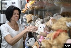 Nataliya Kirichenko, 56, works at a gift shop in Kramatorsk, amid Russia's invasion of Ukraine, July 2, 2022.