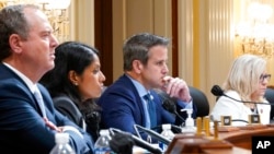 From left, Rep. Adam Schiff, D-Calif., Soumya Dayananda, committee investigative staff counsel, Rep. Adam Kinzinger, R-Ill., and Vice Chair Liz Cheney, R-Wyo., listen to proceedings of the House select committee's investigation of the Jan. 6 attack on the U.S. Capitol, at the Capitol in Washington, June 23, 2022.