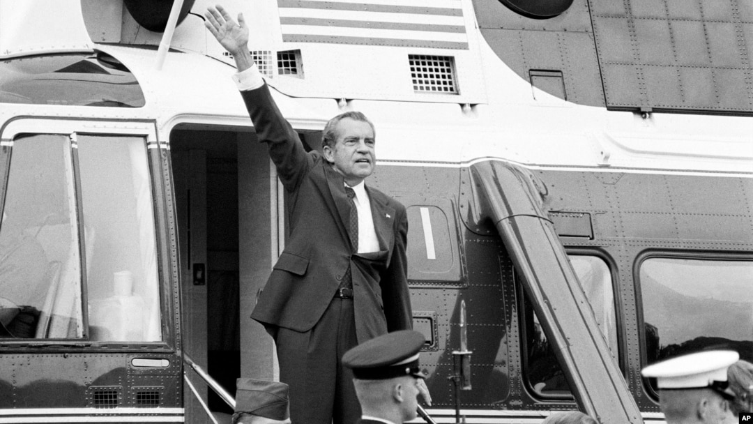 FILE - In this Aug. 9, 1974 file photo, President Richard Nixon waves goodbye from the steps of his helicopter outside the White House, after he gave a farewell address to members of the White House staff.