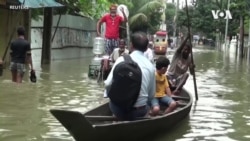 Residents of Bangladesh Navigate Flooded Streets