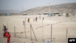 FILE: People leave a health clinic outside the internally displaced persons (IDP) camp of Guyah, 100 kms of Semera, Afar region, Ethiopia. Taken 5.17.2022