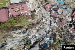 An aerial view of Petobo sub-district following an earthquake in Palu, Central Sulawesi, Indonesia, Oct. 2, 2018 in this photo taken by Antara Foto.