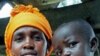 A Rwandan woman holds her child, who is recovering from a cleft-palate surgery performed during a mission by South Africa based Operation Smile, in Kigali, Rwanda, March 22, 2012.