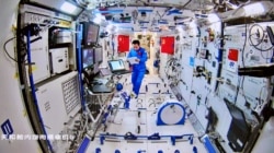 Chinese astronaut Tang Hongbo of the Shenzhou-12 mission works inside the core module Tianhe of the Chinese space station, in this image released by China Manned Space Engineering Office, Aug. 20, 2021.