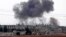 FILE - Smoke billows following Syrian government forces' bombardment around the town of Al Habit on the southern edges of the rebel-held Idlib province, Sept. 9, 2018. 