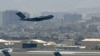 A U.S. Air Force aircraft takes off from the airport in Kabul on August 30, 2021.