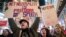 Demonstrators rally in support of net neutrality outside a Verizon store, Dec. 7, 2017, in New York. 