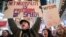 Demonstrators rally in support of net neutrality outside a Verizon store, Dec. 7, 2017, in New York. 