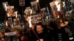 Relatives and friends of people killed and abducted by Hamas and taken into Gaza react to the ceasefire announcement as they take part in a demonstration in Tel Aviv, Israel, Jan. 15, 2025.