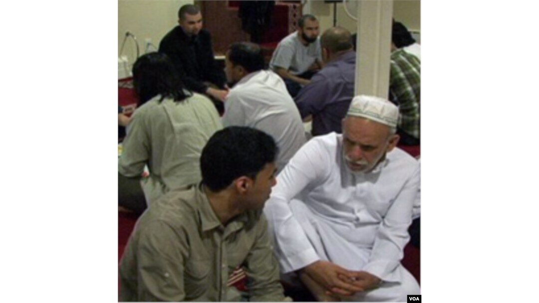 A student conversing with an elderly at Golden Islamic Center, Colorado.