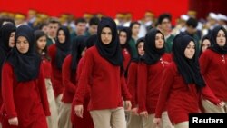 FILE - Students of an Imam Hatip high school march during a Republic Day ceremony in Ankara, Turkey.