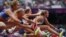 Natallia Dobrynska (R) of Ukraine, leads the field as she competes in her women's heptathlon 100m hurdles heat during the London 2012 Olympic Games at the Olympic Stadium August 3, 2012.