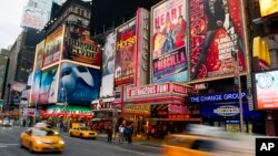 FILE - This Jan. 19, 2012 file photo shows billboards advertising Broadway shows in Times Square, in New York. (AP Photo/Charles Sykes, file)