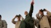 FILE - A photo by the government-controlled Syrian Central Military Media, shows Iran's Army Chief of Staff Maj. Gen. Mohammad Bagheri, left, and other senior officers on the front line in the northern province of Aleppo, Syria, Oct. 20, 2017.