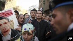 Demonstrators take part in a protest condemning the killings that happened on Wednesday at Port Said stadium, in front of the parliament in Cairo February 2, 2012.