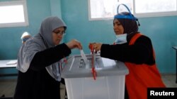A Palestinian votes in the municipal elections, near Jenin in the Israeli-occupied West Bank, Dec. 11, 2021.