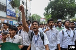 Bangladeshi students march along a street during a student protest in Dhaka, Aug. 4, 2018, following the deaths of two college students in a road accident.