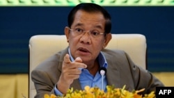 In this file photo taken on September 17, 2021, Cambodia's Prime Minister Hun Sen gestures during a press conference at the Peace Palace in Phnom Penh. 