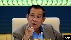 FILE - In this file photo taken on September 17, 2021, Cambodia's Prime Minister Hun Sen gestures during a press conference at the Peace Palace in Phnom Penh.